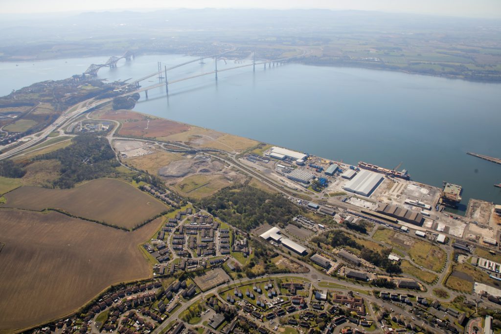aerial view of industrial space by a river