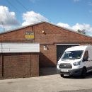 warehouse unit with van parked in front