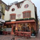 restaurant building with outdoor dining in front