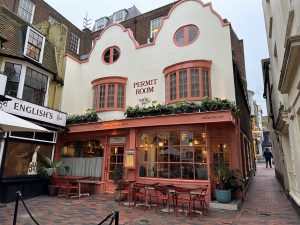 restaurant building with outdoor dining in front 