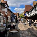 cobbled street with retail units either side