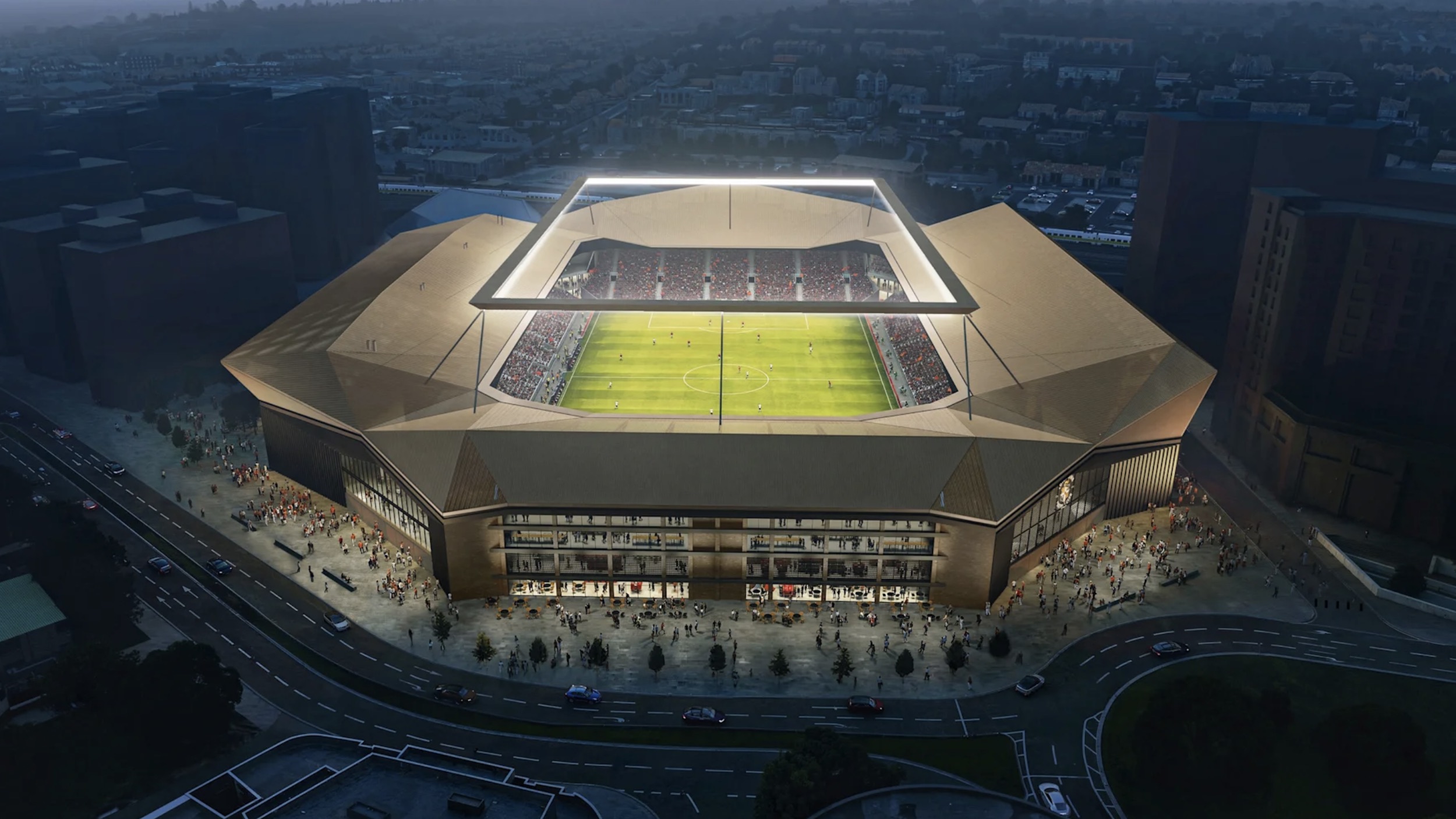 aerial view of football stadium lit up at night 