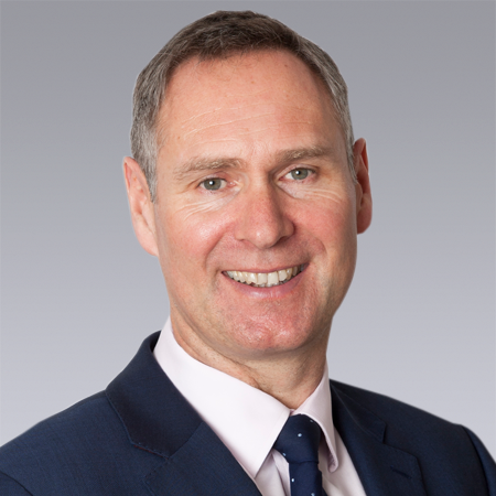 head and shoulders photo of man in suit and tie 