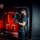 cameraman standing in front of a door